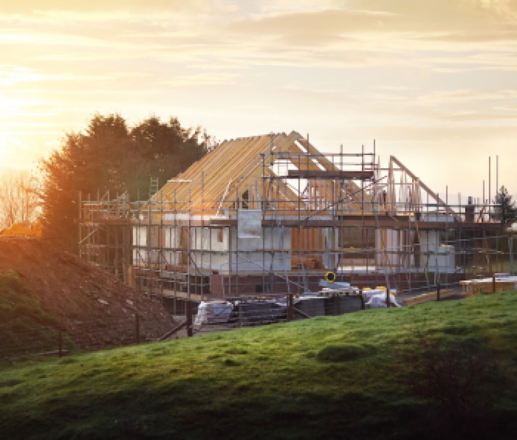 Building site with house under construction