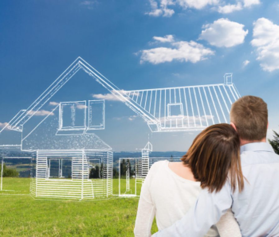 Young couple looking at dream house.