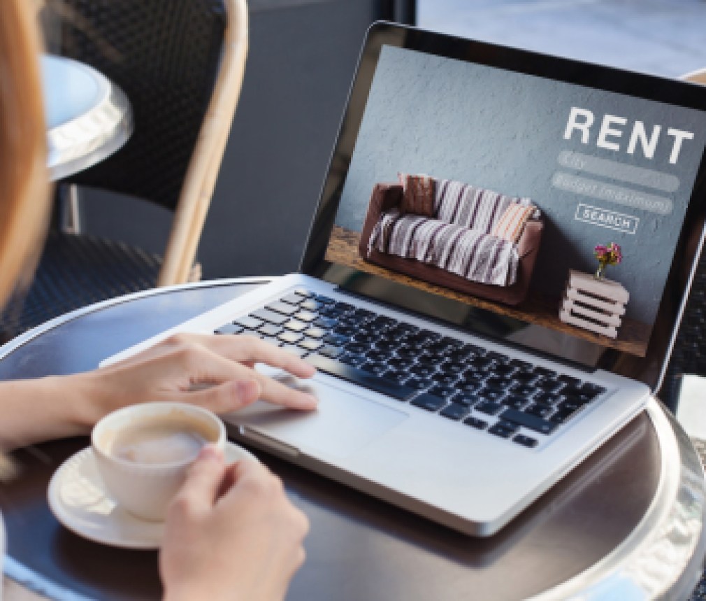 rent online concept, woman using internet website for rental apartments, houses and flats