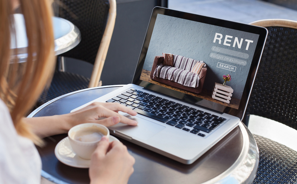 rent online concept, woman using internet website for rental apartments, houses and flats