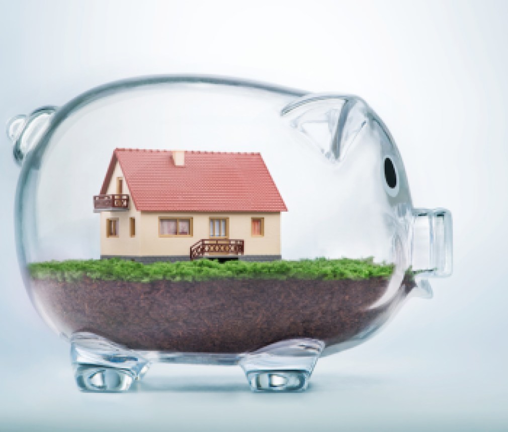 Saving to buy a house or home savings concept