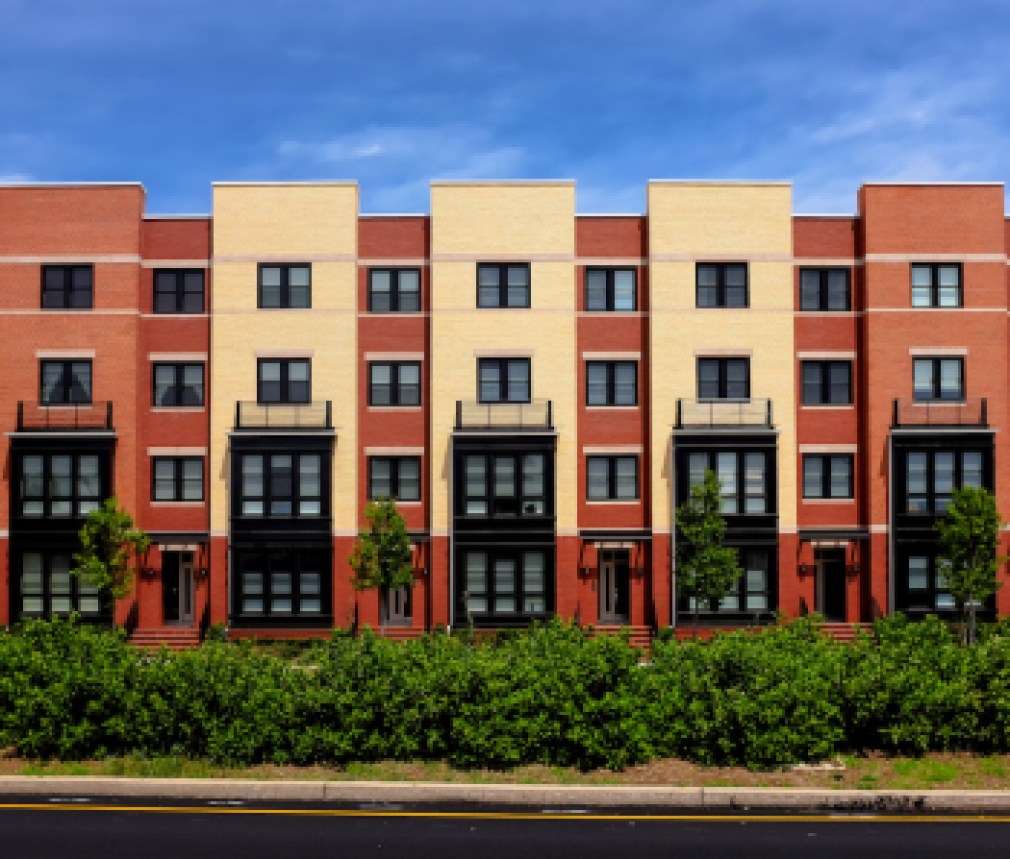 Modern apartment buildings on a sunny day with a blue sky