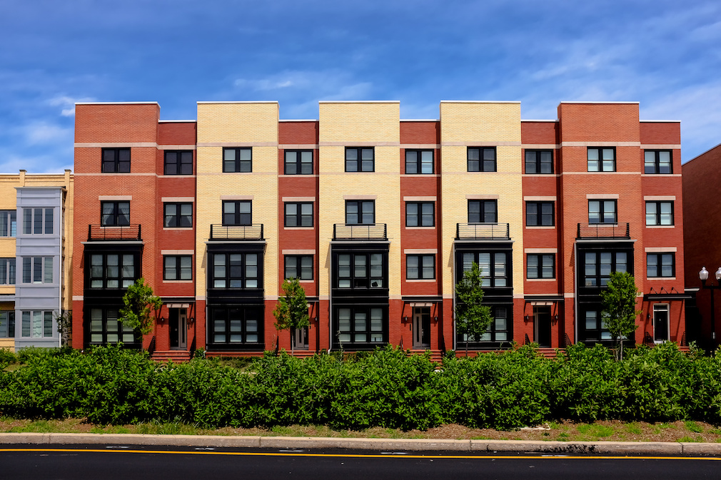 Modern apartment buildings on a sunny day with a blue sky