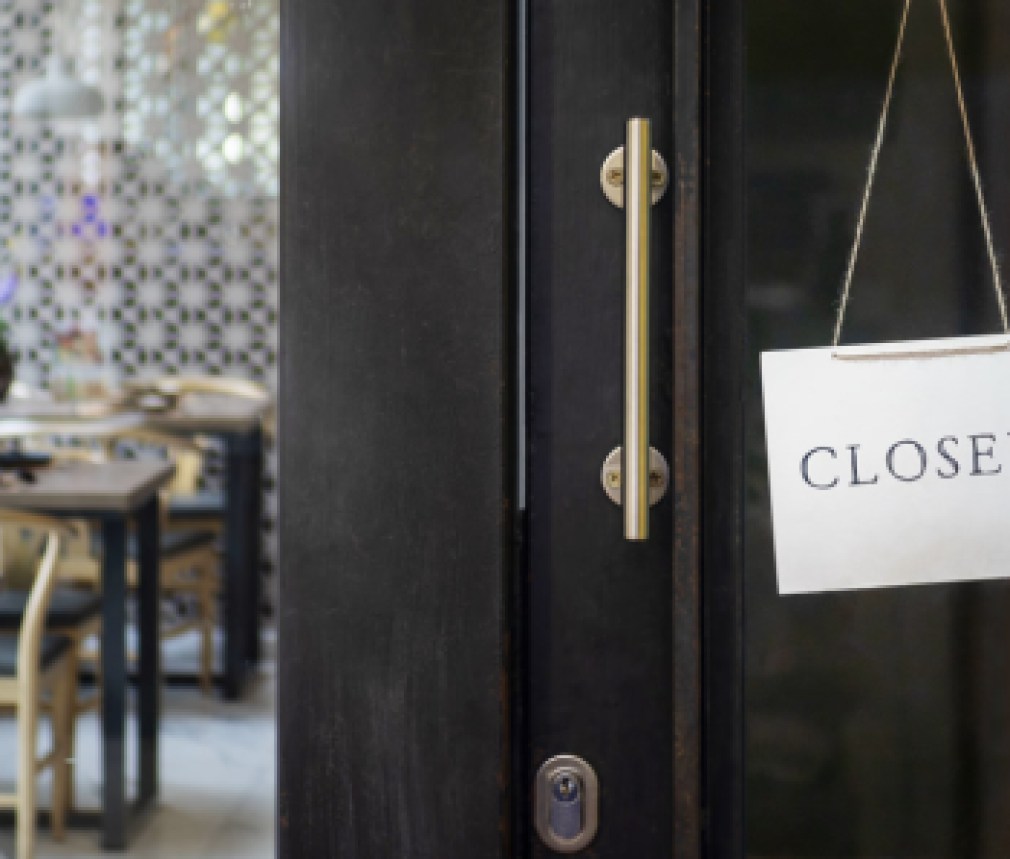 closed sign hanging outside a restaurant, store, office or other