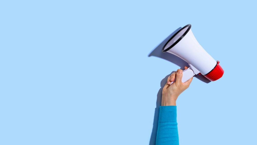 Person holding a megaphone