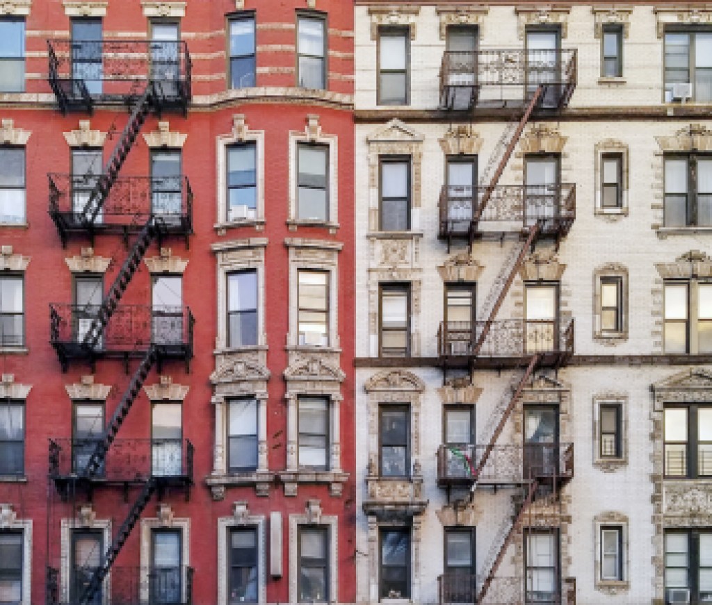 New York City historic apartment building panoramic view with windows and fire escapes