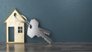 Mortgage, investment, real estate and property concept - close up of house keys. 3d rendering