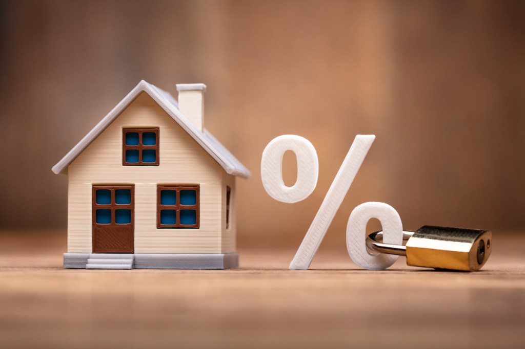 House Model Near Percentage Sign With Keypad Lock