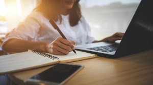 young woman  with learning language during online courses using netbook