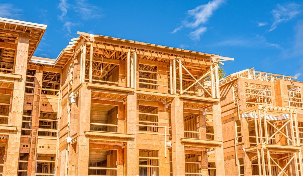 Apartment building under construction on sunny day