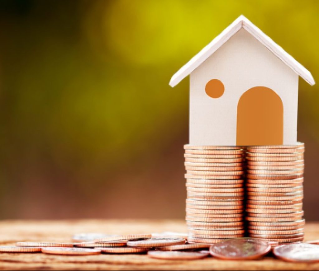 Loan or saving money for buy a house and real estate for family concept, Home model put on the stack coin tower with growing business investment in the in the public park.