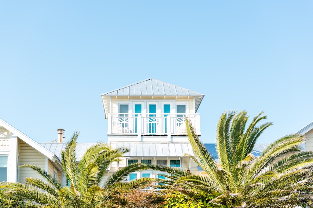 Wooden house tower new urbanism modern architecture by beach ocean, nobody in Florida view during sunny day