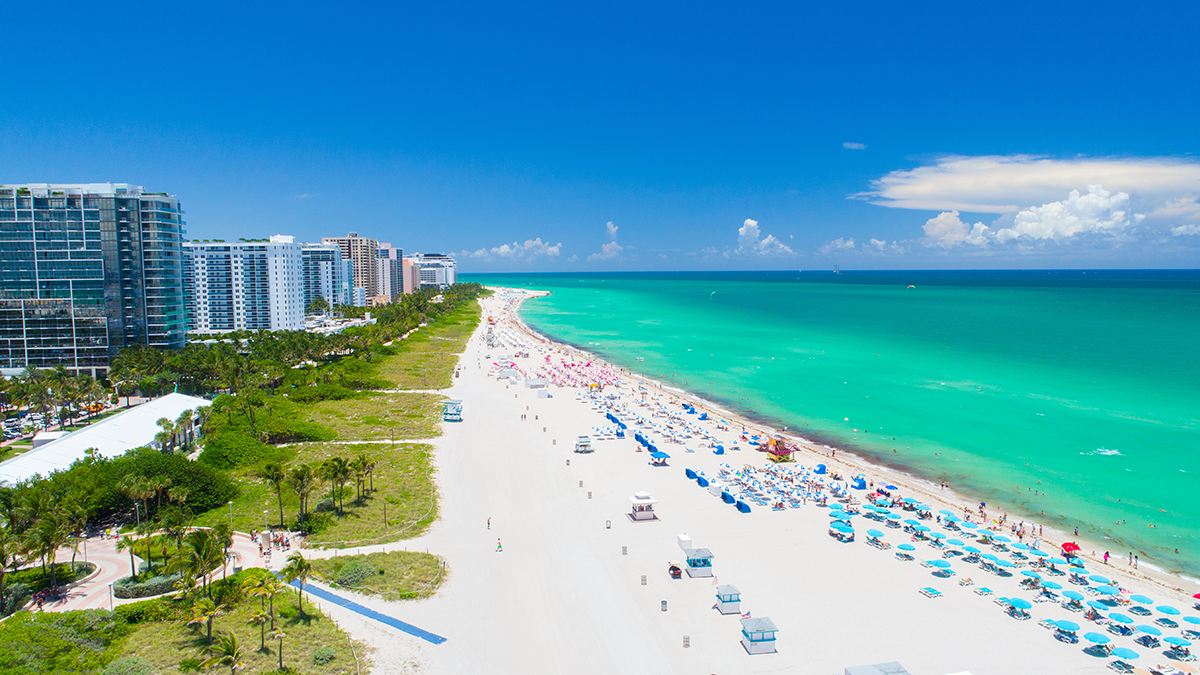 Aerial view of white sand and turquoise ocean in South Beach in Miami, Florida