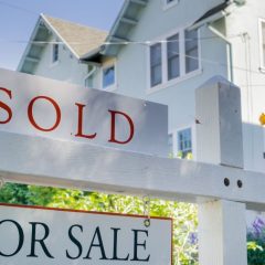 for sale sign showing that a home has been sold