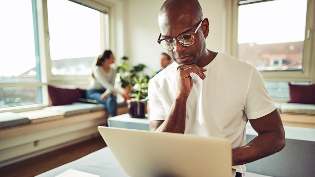 Man working on his laptop in an office