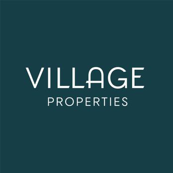 Village Properties logo with dark background